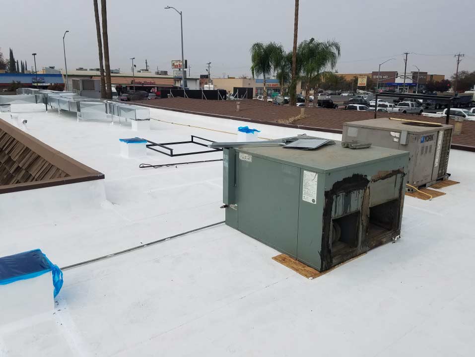 flat-roof-coating flat roof coating of a commercial building in bakersfield