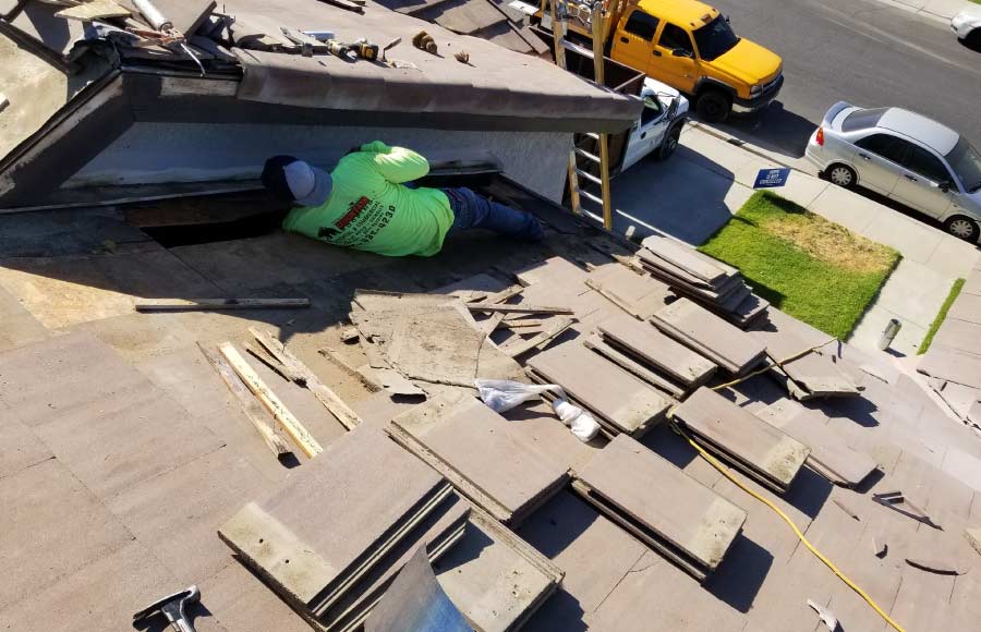 Durable tile roof installation project underway on a commercial property in Arvin's city center.