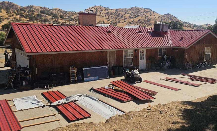 A modern home featuring a newly installed standing seam metal roof, showcasing its long lifespan.
