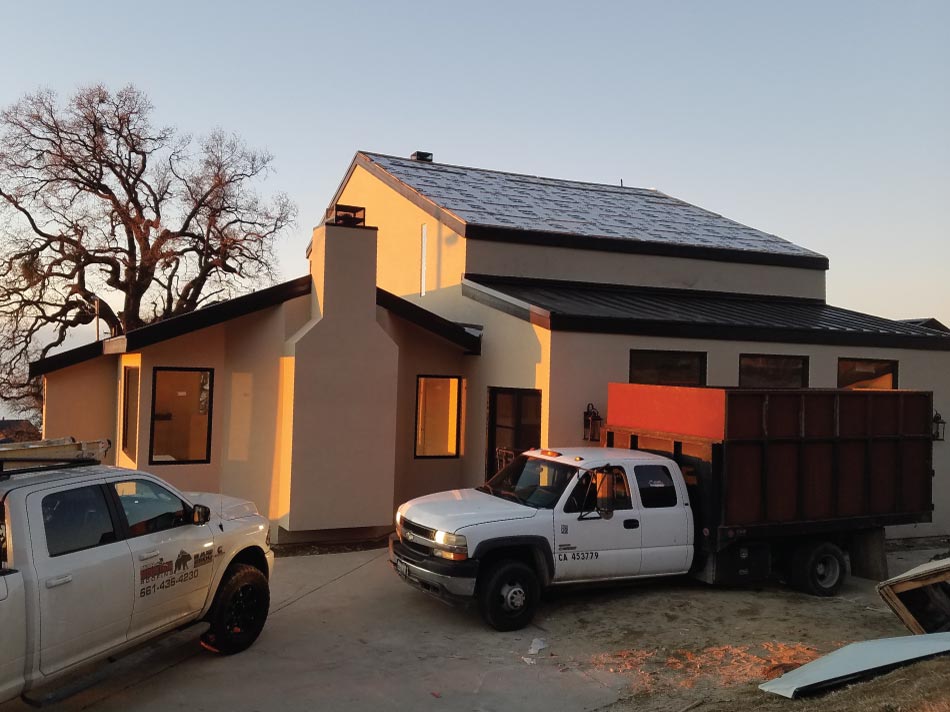 Professional crew from Bear Mountain Roofing Inc. performing an asphalt shingle Roof installation in Wasco, CA on a local home.